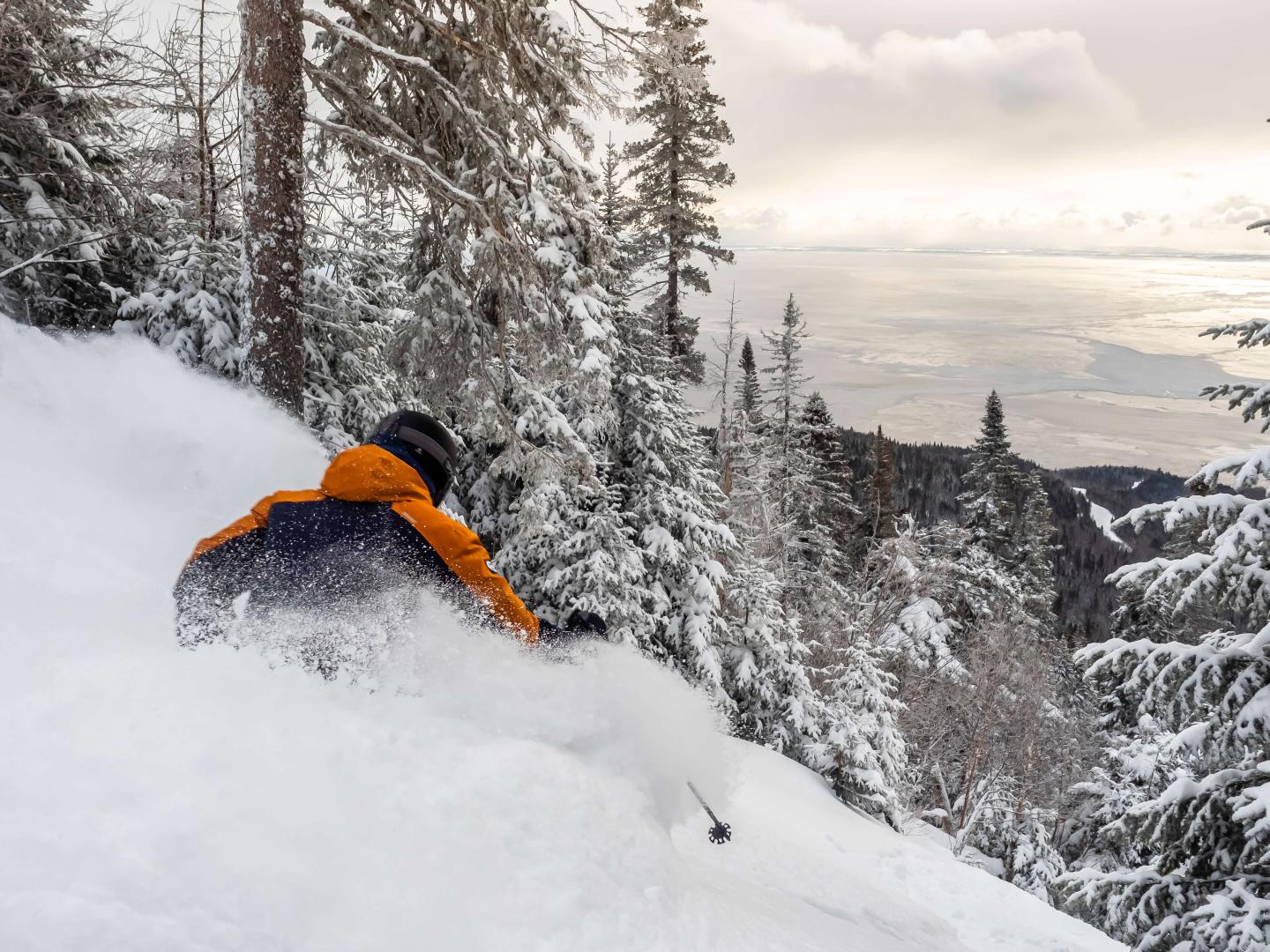 person backcountry skiing on mountain