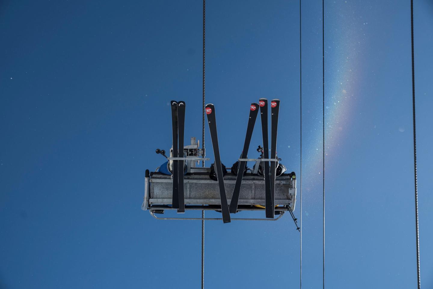 looking up at skiers on chairlift at le massif resort