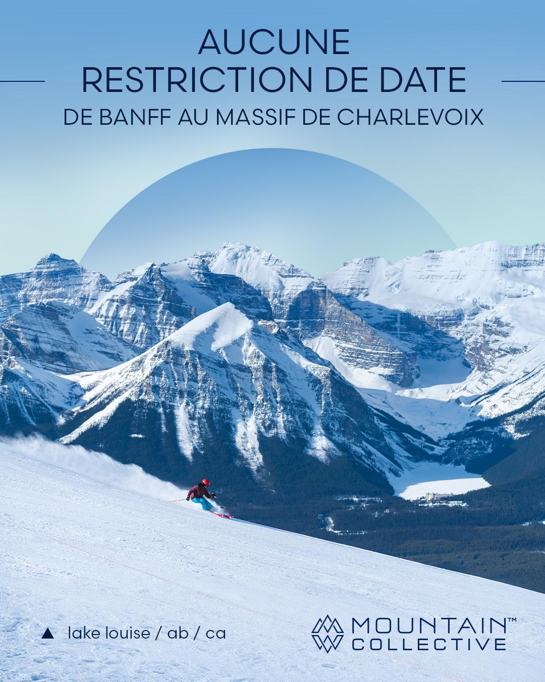 Skieur dévalant une piste enneigée avec montagnes en arrière-plan sous un ciel bleu.