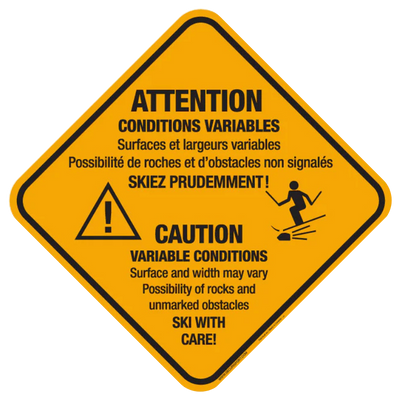 Panneau jaune avertissant des conditions variables pour les skieurs.