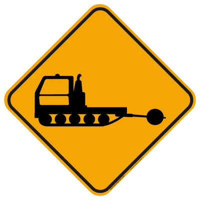 Panneau jaune avec silhouette de dameuse.